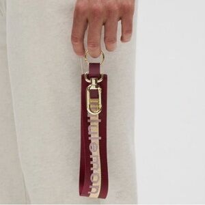NEW Lululemon Never lost Keychain Wordmark Deep Luxe Gold Bone Burgundy